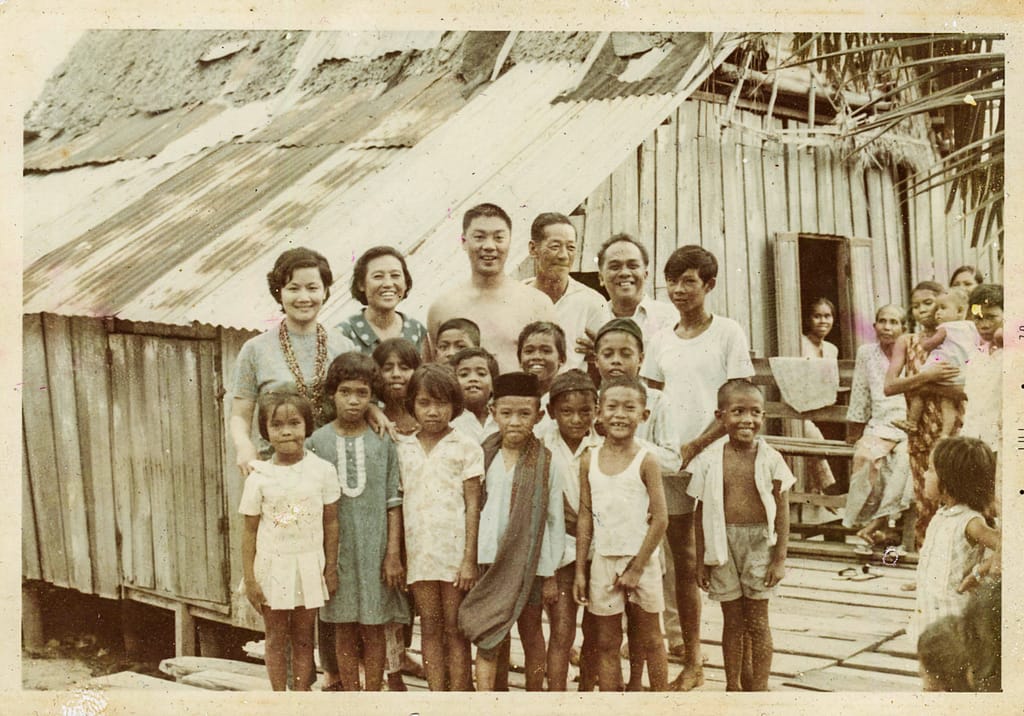 1960s photograph of wooden stilt houses on St John's and Lazarus Island