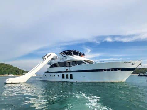 Bondway 75 Anka motor yacht anchored near Singapore with a large inflatable water slide deployed