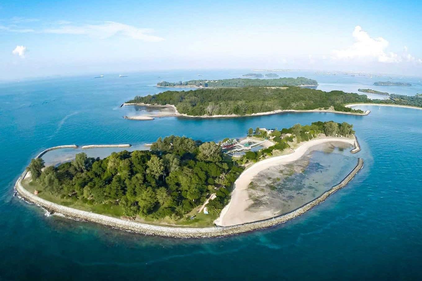 High aerial view of Kusu Island and the Southern Islands of Singapore with twin lagoons and turquoise sea