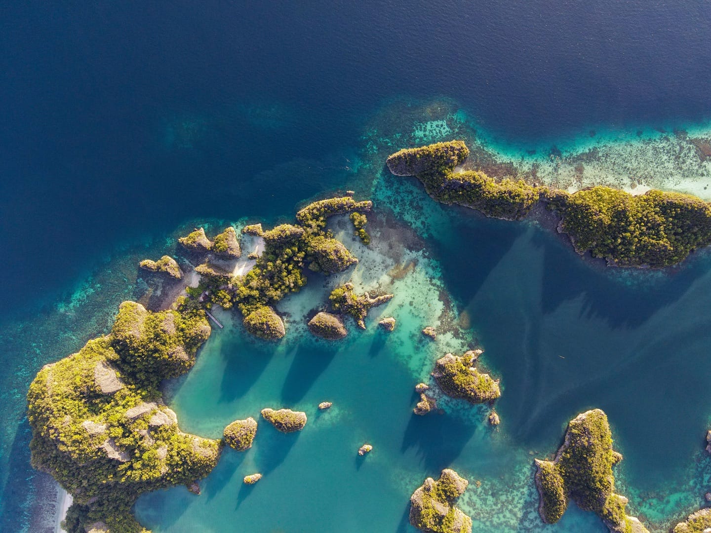 Yacht charter in Indonesia — phinisi sailing the waters of Raja Ampat